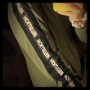 A cropped army green long sleeve shirt